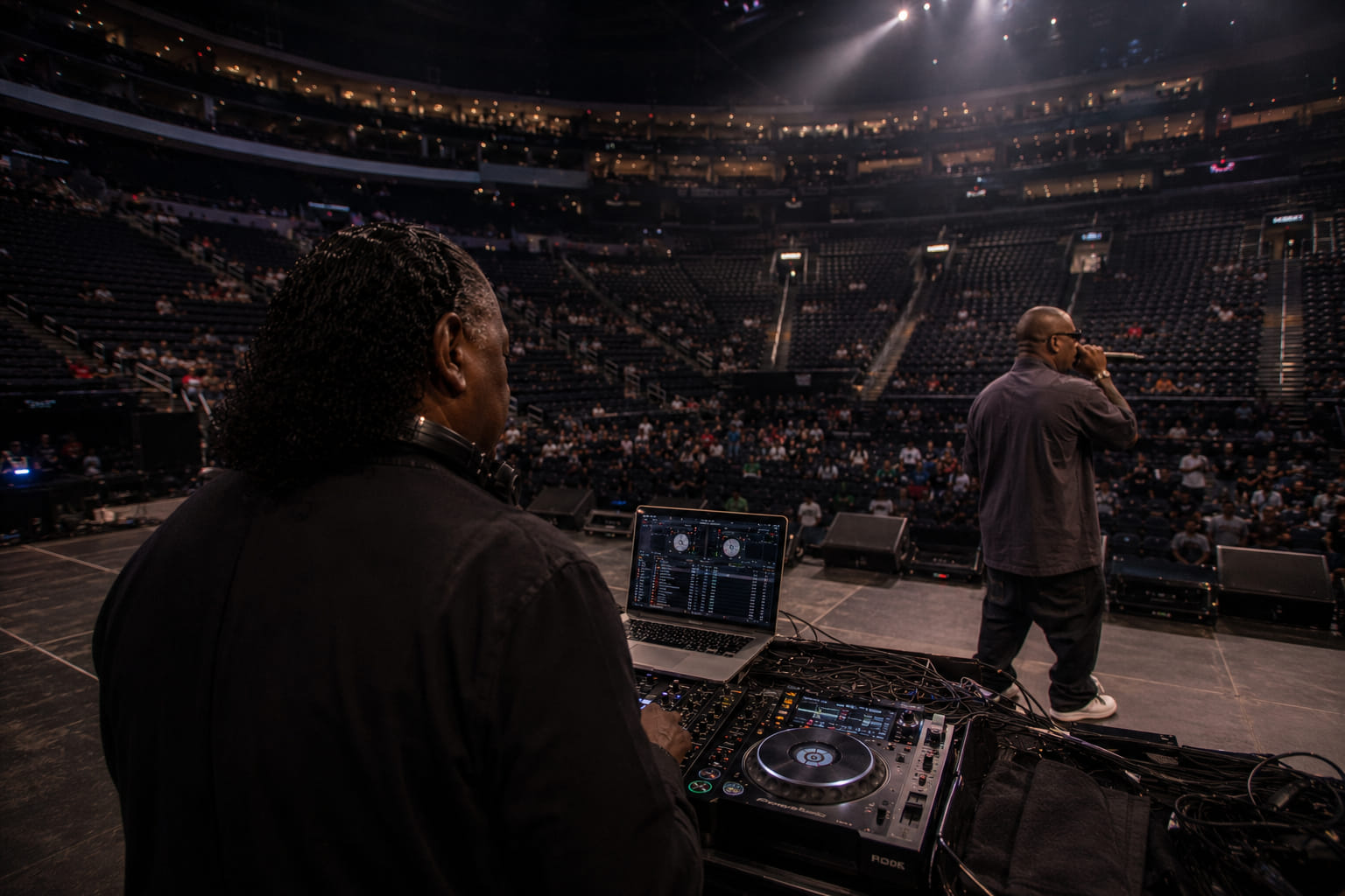 Bart at a large arena DJ setup from behind